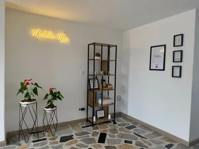 a room with a shelf and some plants on a wall at Apartamento para 5 personas en Laureles, Estadio in Estación El Salto