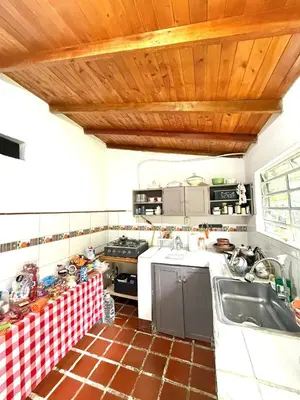 a kitchen with white counters and a wooden ceiling at Villa Amparo Casa Finca in Rionegro