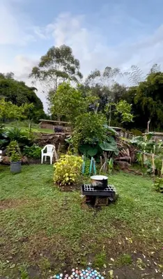 a garden with a grill in the grass at Villa Amparo Casa Finca in Rionegro