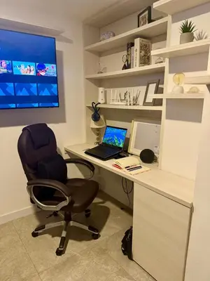a office with a desk with a laptop and a chair at Eternal Springs 8pp, 3br, 2bt, 3acs, Pool, Jacuzzi in Medellín