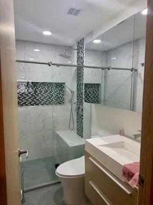 a bathroom with a shower and a toilet and a sink at Eternal Springs 8pp, 3br, 2bt, 3acs, Pool, Jacuzzi in Medellín