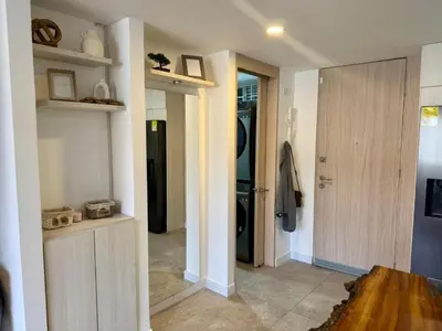 a room with a hallway with a door to a kitchen at Eternal Springs 8pp, 3br, 2bt, 3acs, Pool, Jacuzzi in Medellín