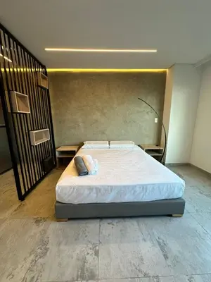 a bedroom with a bed in a room at Apartaestudio in Medellín