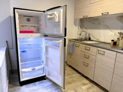 a refrigerator with its door open in a kitchen at Casa Alba, El Poblado in Medellín