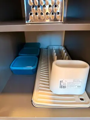 a shelf with a bowl and other items in a refrigerator at Estrena Apartamento, Avenida Santander, BREAK SUITES in Manizales