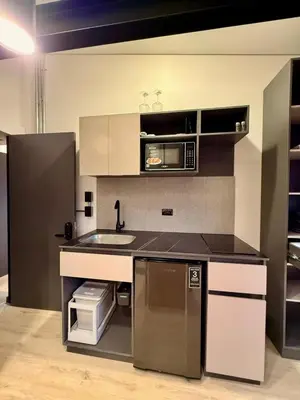 a kitchen with a sink and a microwave at Estrena Apartamento, Avenida Santander, BREAK SUITES in Manizales