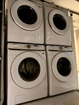 three washing machines are stacked next to each other at Estrena Apartamento, Avenida Santander, BREAK SUITES in Manizales