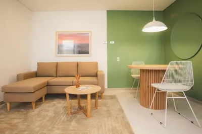 a living room with a couch and a table at NOK Splendid studio in Laureles Medellin in Medellín