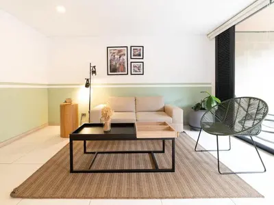 a living room with a couch and a coffee table at NOK Panoramic 3 BR in Laureles Medellin in Medellín