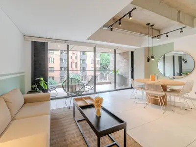 a living room with a couch and a table at NOK Panoramic 3 BR in Laureles Medellin in Medellín