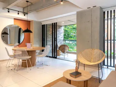 a dining room with a table and chairs at NOK Panoramic 3 BR with terrace in Laureles Medellin in Medellín