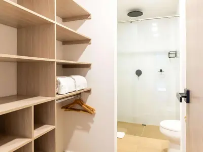 a bathroom with a toilet and a shower at NOK Panoramic 3 BR with terrace in Laureles Medellin in Medellín