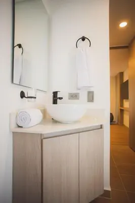 a bathroom with a sink and a mirror at NOK Cozy 3 BR in Laureles in Medellin in Medellín