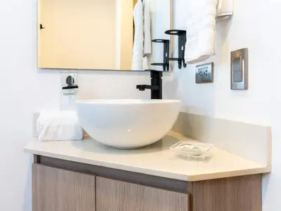 a bathroom with a white bowl sink on a counter at NOK Perfect 3 BR with Balcony in Laureles Medellin in Medellín