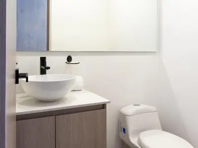a bathroom with a bowl sink and a toilet at NOK Fantastic 3 BR w Balcony in Laureles Medellin in Medellín
