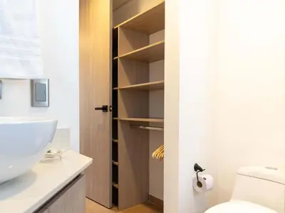 a bathroom with a toilet and a sink at NOK Fancy 3BR Balcony in Laureles Medellin in Medellín