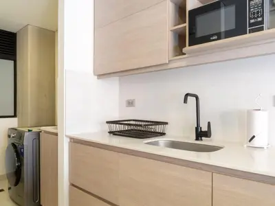 a kitchen with a sink and a microwave at NOK Stylish 3BR in Laureles MDE in Medellín
