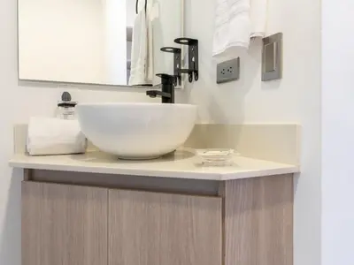 a bathroom with a bowl sink on a counter at NOK Charming 3BR in Laureles Medellin in Medellín