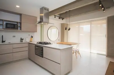 a kitchen with a stove and a counter top at NOK Perfect 3 BR in Laureles in Medellin in Medellín
