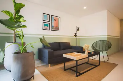 a living room with a couch and a table at NOK Perfect 3 BR in Laureles in Medellin in Medellín