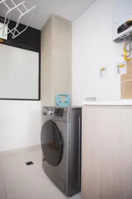a kitchen with a washing machine in a room at NOK Cool 3 BR With Balcony in Laureles Medellin in Medellín