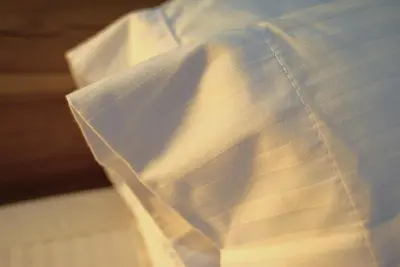 a close up of a white shirt with a tie at Mountain Views, AC, King Bed, Fast WiFi in Medellín