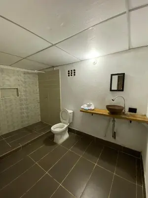 a bathroom with a sink and a toilet at Refugio de Sueños in San Rafael