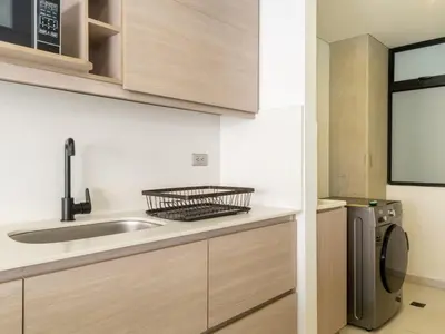 a kitchen with a sink and a washing machine at NOK Bright 3BR with terrace in Laureles Medellin in Medellín