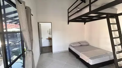 a bedroom with a bunk bed and a mirror at Villa Serena Sopetran in Sopetran