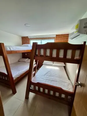 two bunk beds in a room with a window at Apartamento Oasis in Sopetran
