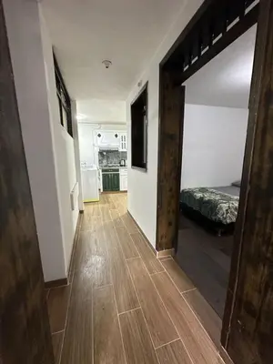a hallway with a room with a bed in it at Hermoso apartamento en la milagrosa in Medellín
