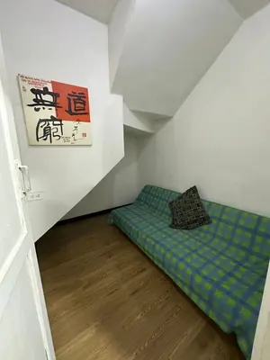 a small room with a bed in a attic at Hermoso apartamento en la milagrosa in Medellín