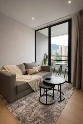 a living room with a couch and a table at Monaco by Top Location City View in Medellín