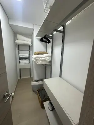 a small room with a closet with white towels at Monaco by Top Location City View in Medellín