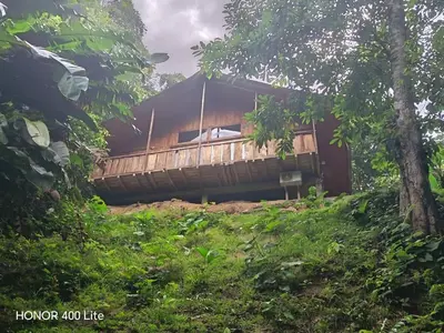 a house sitting on top of a hill at Reserva El Paujil in Puerto Boyacá