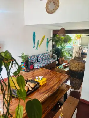 a living room with a table and a couch at Casa Olivia in Honda