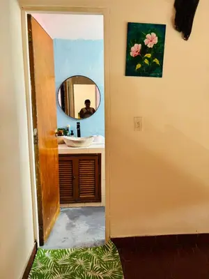 a bathroom with a sink and a mirror at Casa Olivia in Honda