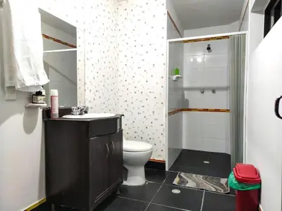 a bathroom with a toilet and a shower at Hostal Casa Coliving Laureles Medellin in Medellín