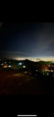 a view of a city at night with lights at Villa with Spectacular Medellin View with Pool and Mini Basket-Futbol Field in Medellín