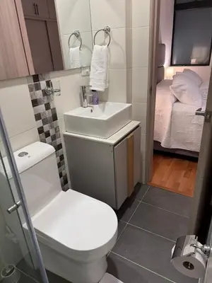 a small bathroom with a toilet and a sink at Confortable y acogedor apartamento en Itagüi in Itagüí