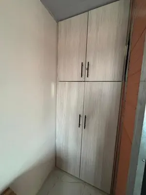 a room with three wooden cabinets in a room at Casa Amoblada Acogedora para familias in Norcasia