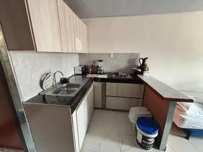 a small kitchen with a sink and a counter at Casa Amoblada Acogedora para familias in Norcasia