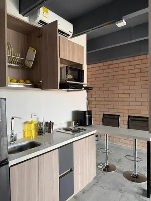 a kitchen with a sink and a counter top at Loft cerca metro Floresta y Estadio - Aire acondicionado in Medellín