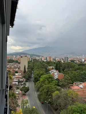 a view of a city with a street and trees at Loft cerca metro Floresta y Estadio - Aire acondicionado in Medellín