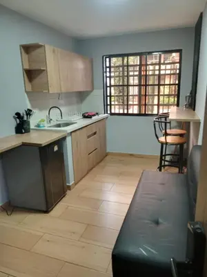a kitchen with a sink and a counter top at Apartamentos laureles Estadio in Medellín