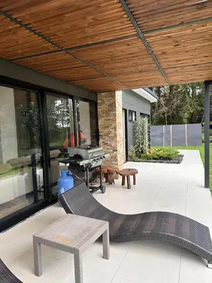 a patio with a grill and a picnic table at Linda Vista in Rionegro