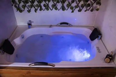a jacuzzi tub in a small room with at Finca Las Palmas - San Luis in San Luis