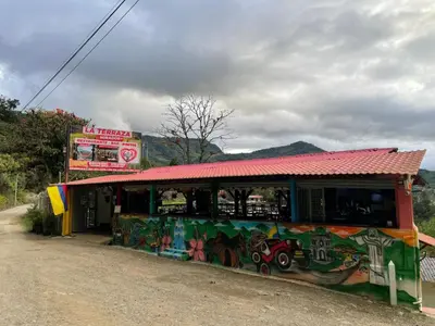a building with graffiti on it on the side of a road at Hotel Casa Campestre in Jardin