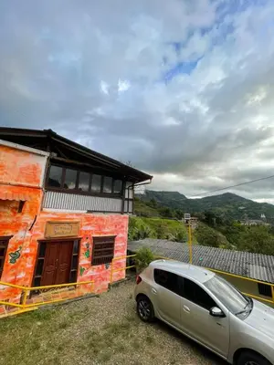 a car parked in front of a building at Hotel Casa Campestre in Jardin