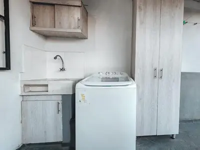 a kitchen with a white refrigerator and a sink at Beautiful Duplex Apt in Cabañas Bello Antioquia in Medellín